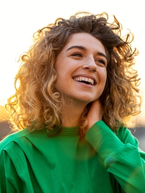 Woman smiling with curly hair