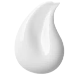 A white droplet of cream being smeared upwards.
